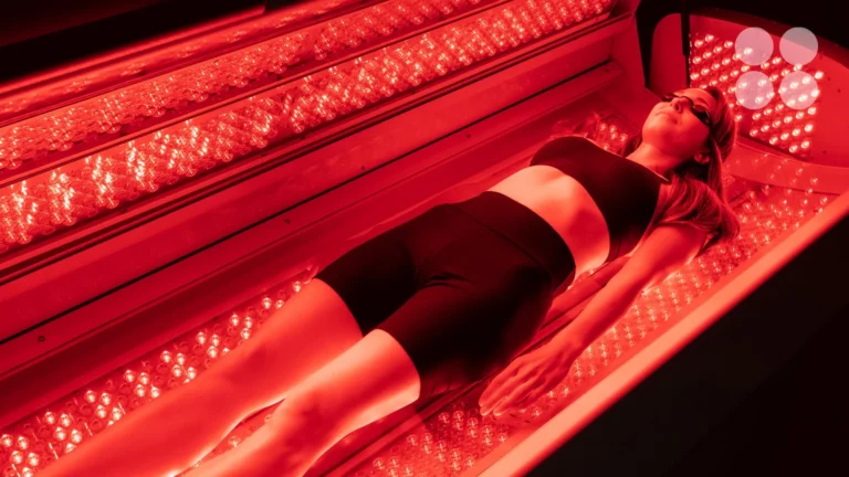 A patient lying in the red light therapy bed at Integral Wellness Co. in Johnson City